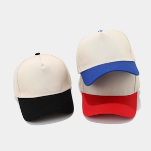 Three two-tone patchwork cotton baseball caps in beige with black, blue, and red brims