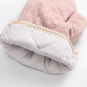 Pink checkered cotton oven mitt showing white diamond quilted thick heat insulation layer