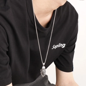 Gothic lion head skull pendant necklace in silver stainless steel for men on model