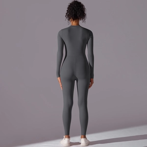 Detail of grey athletic jumpsuit showing high elasticity fabric and slimming back seams