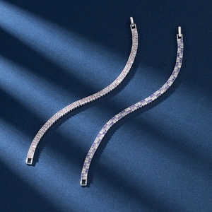 Macro detail of high-quality pink and purple gradient tennis bracelets with cubic zirconia