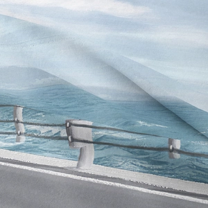 Detailed close-up showing digital print texture and coastal road pattern on fabric