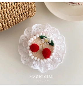 Detail of cute lace hair hoop with red plush cherries and white daisy for girls