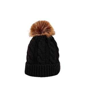 Classic black cable-knit beanie featuring a fluffy tan faux fur pom and folded cuff