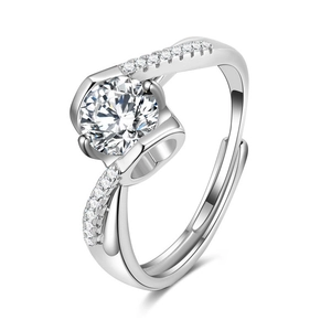 Detailed view of silver crown six-prong ring with large center stone and small pavé diamonds