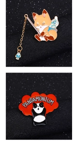 Detail of fishing fox enamel pin and Panda with Pandamonium text on dark background