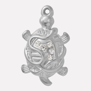 Detailed close-up of a silver turtle pendant with five sparkling inlaid rhinestones