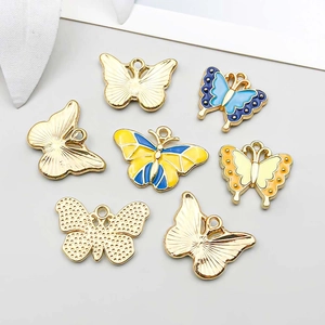 Detailed top view of colorful butterfly charms showing enamel oil and golden alloy finish