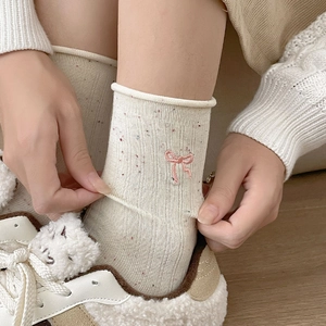 Cream knit mid-calf socks with colorful speckles and pink bow embroidery for women
