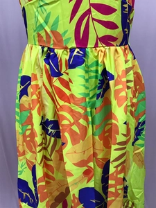 Detailed view of tropical leaf print waist pleats on summer bohemian maxi dress