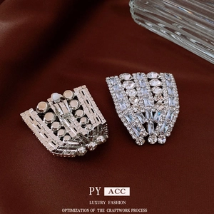 Elegant silver fan-shaped clip-on earrings with pavé rhinestones on silk fabric
