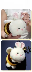 Detail of cute bee bunny plush toy with soft wings and striped yellow and brown body