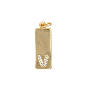 Macro shot of gold-plated rectangular pendant with zircon-encrusted letter V detail
