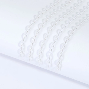 Detailed macro view of white acrylic link chains showing smooth plastic link structure