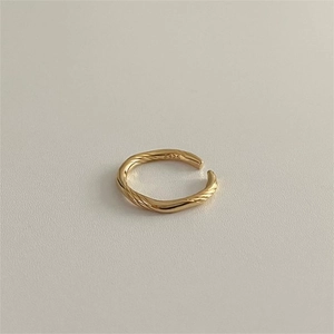 Close-up of gold twist 925 sterling silver ring showing the S925 hallmark and texture