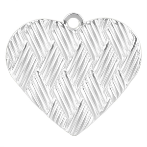Detail of silver heart pendant with textured woven pattern and polished metal finish
