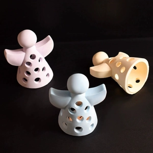 Three hollow angel candle holder molds in pastel colors for DIY home atmosphere decor