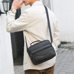 Classic black leather business messenger bag for men with multi-zipper pockets