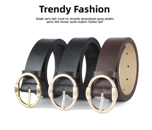 Close-up of three leather belts with round butterfly buckles in black and brown colors