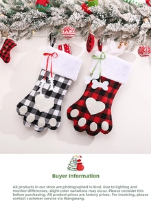 Detail of buffalo plaid pet paw Christmas stockings with faux fur trim and ribbon bow