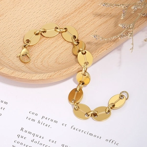 Detail of 18K gold-plated stainless steel coffee bean link bracelet with lobster clasp