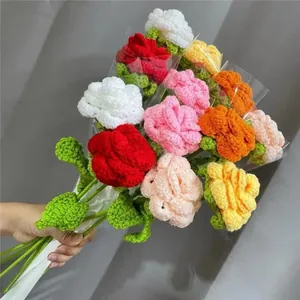 Detailed close-up of colorful handmade crochet flowers with knitted yarn textures