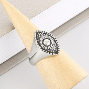 Vintage evil eye sunflower ring in oxidized steel on a wooden display stand