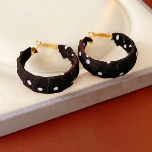 Fashionable large gold hoops wrapped in retro black and white polka dot fabric for women