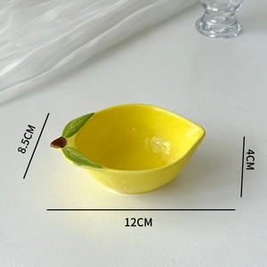 Detailed dimensions of a yellow lemon-shaped ceramic sauce dish on a white background