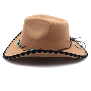 Detail of wool felt cowboy hat with turquoise beads and black stitched brim edge