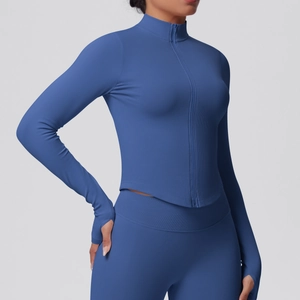 Detail of navy blue ribbed knit yoga jacket featuring thumbholes and stand collar
