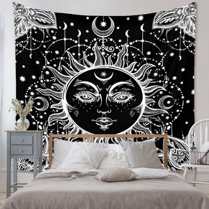 Detail of sun and moon mandala tapestry with mystical bohemian astrology patterns