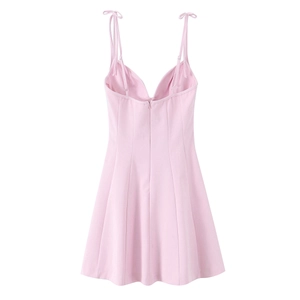 Detail of pink floral poplin mini dress featuring a V-neckline and A-line silhouette