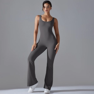 Full body shot of a charcoal grey sleeveless yoga jumpsuit with flare leg cut