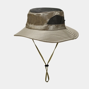 Detail view of khaki outdoor hat featuring breathable black mesh crown and adjustable chin strap