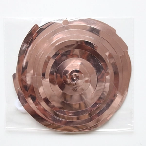 Macro view of rose gold spiral ceiling hanging decorations with hooks in clear packaging