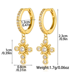 Detail view of gold cross earrings with zircon pavé showing 2.3cm length dimensions