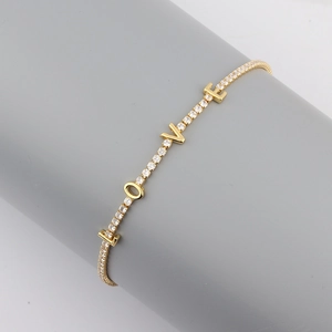 Detailed view of 18K gold plated LOVE necklace featuring sparkling zircon pave settings