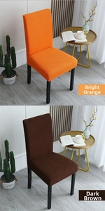 Detail of elastic thickened chair covers in bright orange and dark brown ribbed fabric