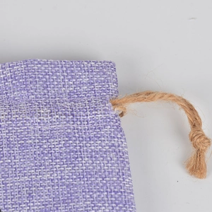 Purple linen-style drawstring pouch with textured natural rope for jewelry or candy storage