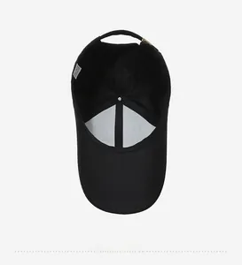 Detailed interior view of black baseball cap showing reinforced seams and adjustable strap