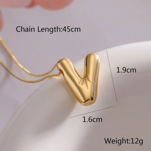 Macro view of gold balloon letter V pendant necklace with size and weight dimensions