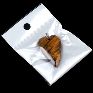 Polished tiger eye heart stone pendant with golden brown texture and metal bail