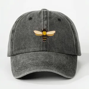 Washed baseball cap with bee print showing 54-59cm head circumference measurements