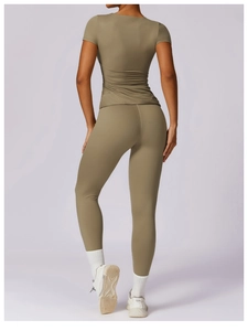 Detailed rear view of a slim-fit yoga t-shirt and high-waist leggings in olive green