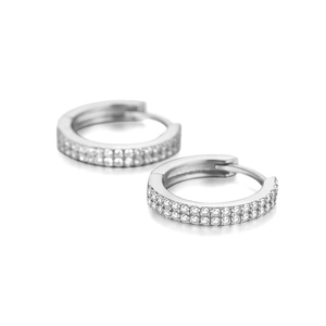 Macro shot of silver S925 sterling silver curved wave hoop earrings with double-row zircon