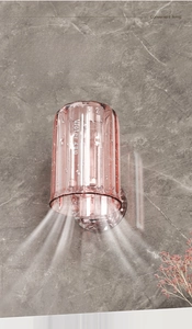 Detail of pink translucent wall-mounted mouthwash cup showing water draining effectively