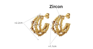 Detailed close-up of C-shaped hoop earrings with zircon inlays and 2.2cm diameter