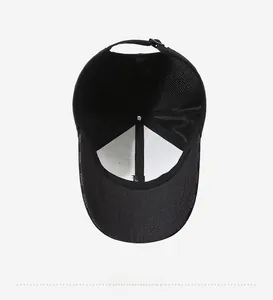 Detail view of the breathable mesh back and inner sweatband of this black baseball cap
