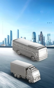Detailed view of silver metal bus and truck keychains featuring laser engraving